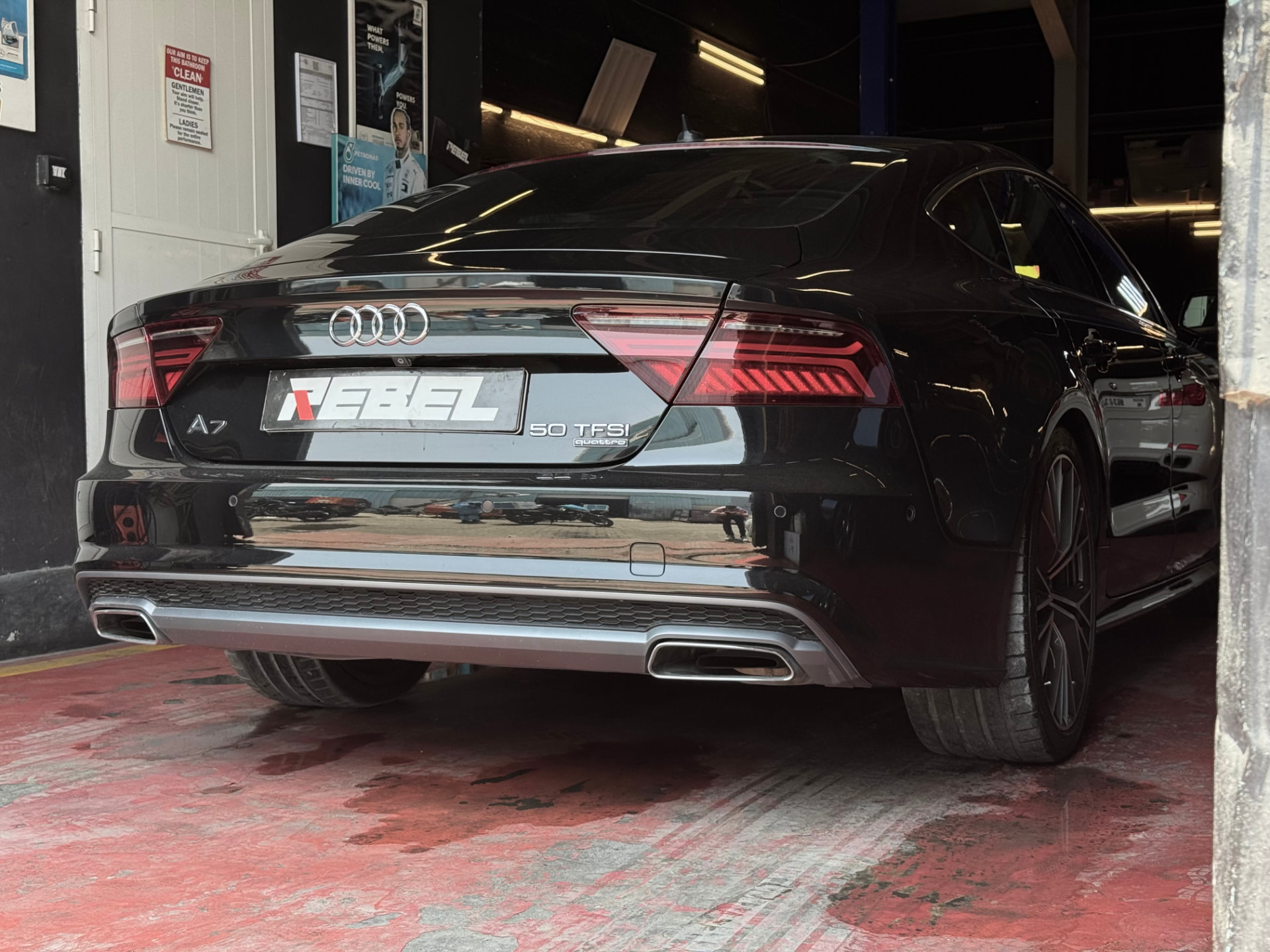 Black Audi A7 50 TFSI quattro in for servicing at Rebel Motorworks Dubai